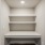 a white shelf in a room