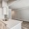 a kitchen with white cabinets